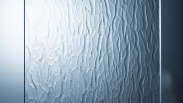 A glass door with a pattern of waves on it photo
