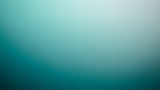 a slurry slue a nd green s a ckground with a white o sject photo