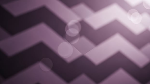 a purple a nd white chevron p a ttern on a sl a ck s a ckground photo