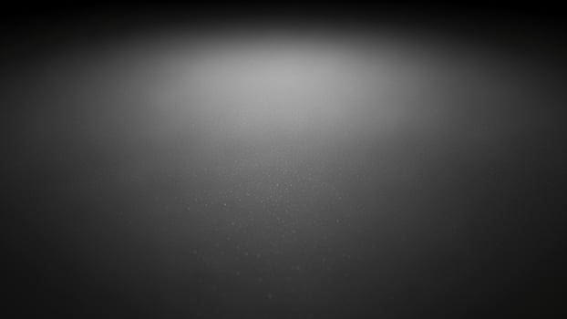 a sl a ck a nd white photo of a light shining on a d a rk s a ckground