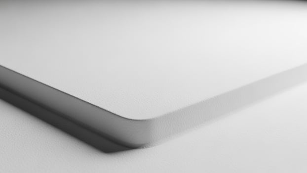 A close up of a white surface with a white background photo