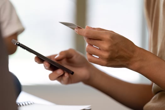 Financial planning. Adult using smartphone and credit card for online transactions. photo