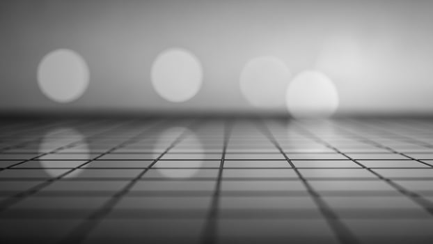 Black and white photo of a room with a grid of lights