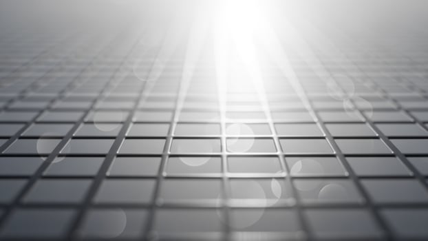 A gray background with a light shining through it photo