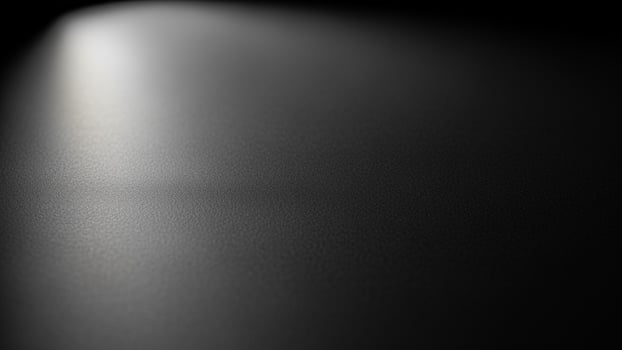 Black background with light shining from the top photo
