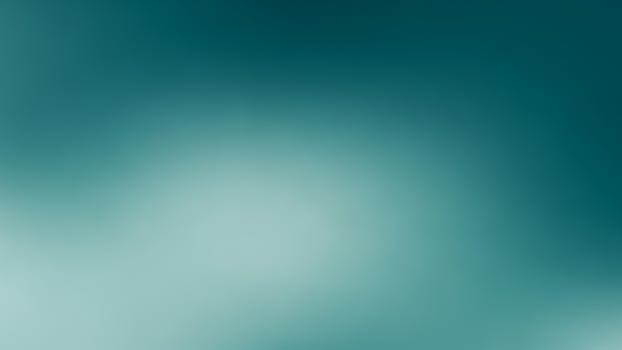 A blurry image of a plane flying over a green background photo