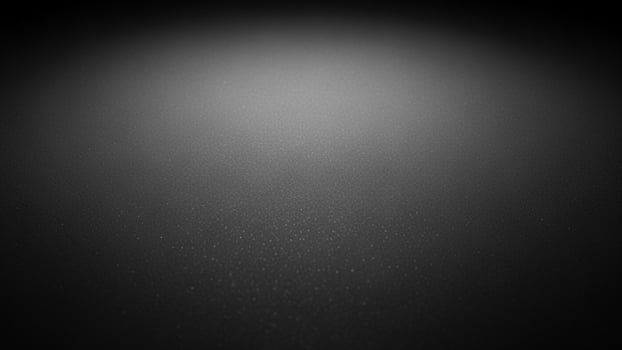 sl a ck a nd white photo of a d a rk room with a light