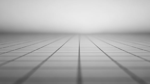 A black and white photo of a grid floor