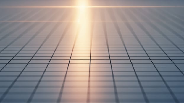 An abstract image of a grid with light shining through it photo
