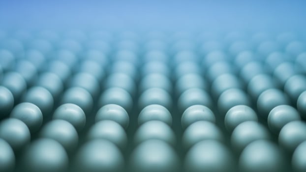 A large number of blue eggs are arranged in a row photo