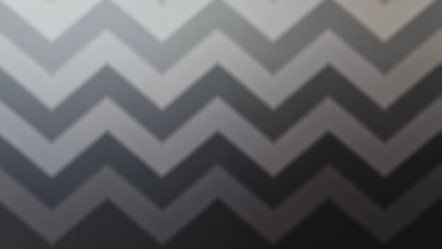 A black and white chevron pattern on a black background photo