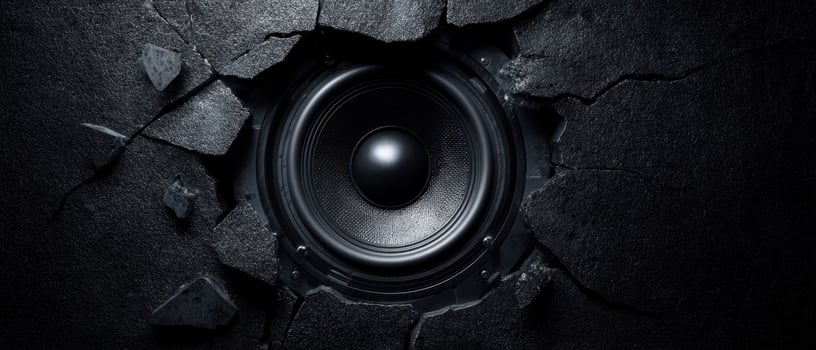 The Speaker Breaking Through a Cracked Dark Wall in Dynamic Fashion photo