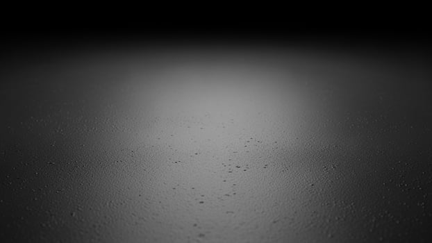 Black and white photo of a wet floor