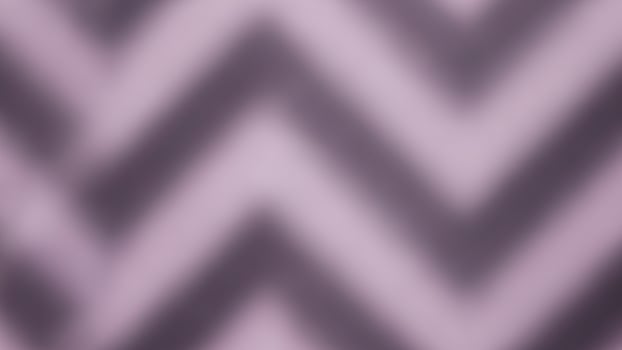 A purple and black chevron pattern on a wall photo