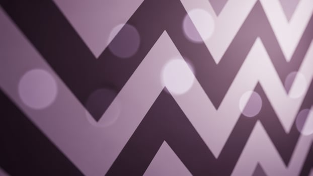 A purple and white chevron pattern on a wall photo
