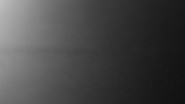 Black and white photo of a black surface