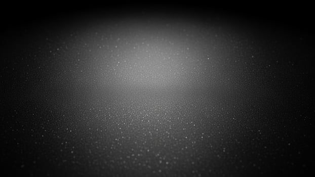 Black and white abstract background with a light shining on it photo