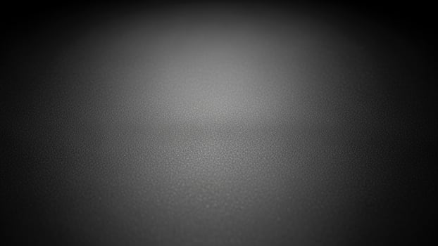Black background with a light shining on it photo