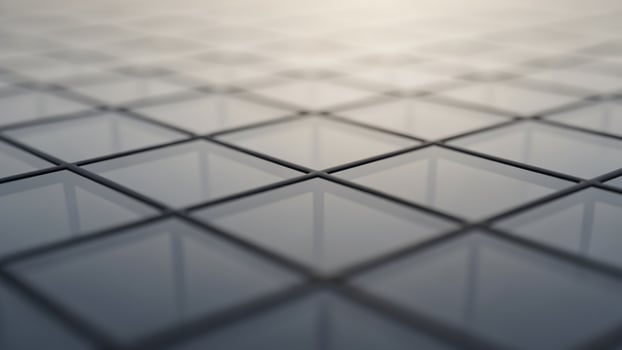A close up of a grid of squares on a surface photo