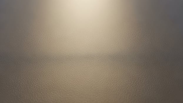 A close up of a shiny surface with light coming from the top photo