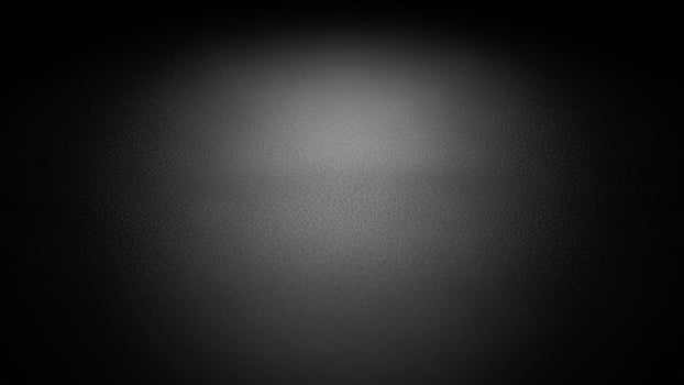 Black background with a light in the center photo