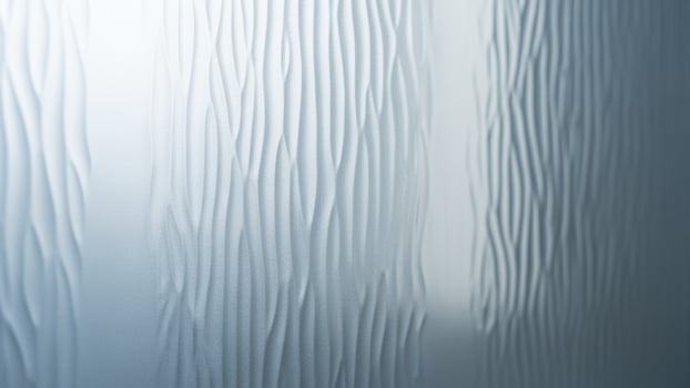 A close up of a glass wall with a wavy pattern photo