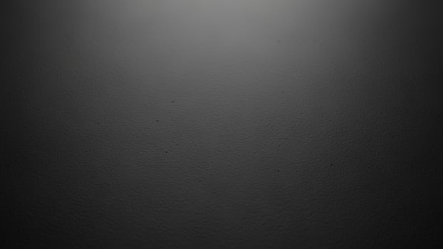 Black background with a light shining through it photo