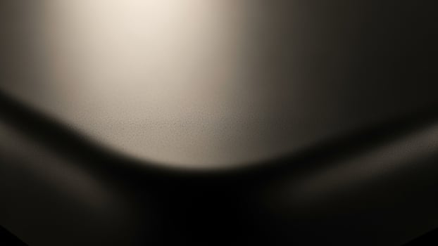 A black and white photo of a curved surface