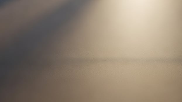 A close up of a light shining through a window photo