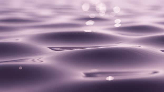 Water ripples on a purple surface photo