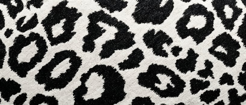 The elegant leopard pattern on fabric showcasing a striking design. photo