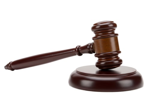 Wooden gavel symbol of justice legal authority and auction hammer isolated on white photo
