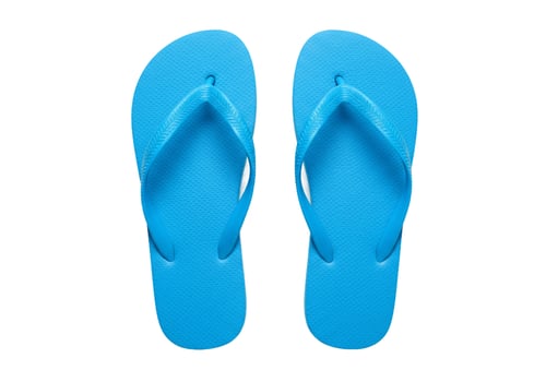 Pair of summer blue flip flops on white background photo