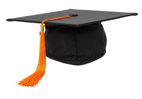 Graduation cap with orange tassel academic achievement symbol photo
