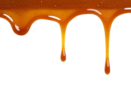 Delicious dripping syrup close up isolated on white background photo