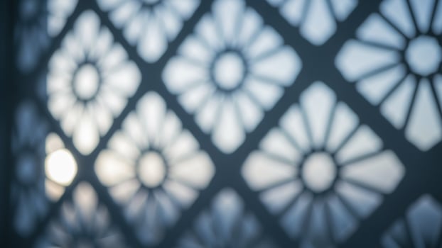 A close up of a window with a pattern on it photo