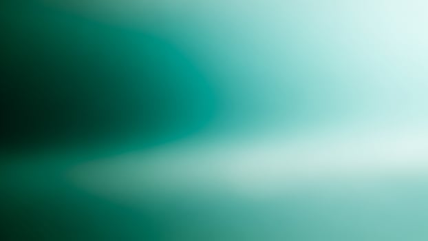 A blurry green background with a white light photo