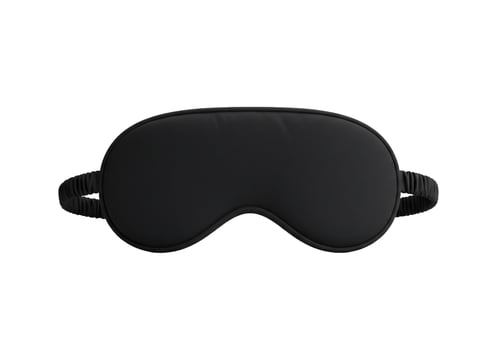 Black sleep mask for relaxation and eye protection on white background photo