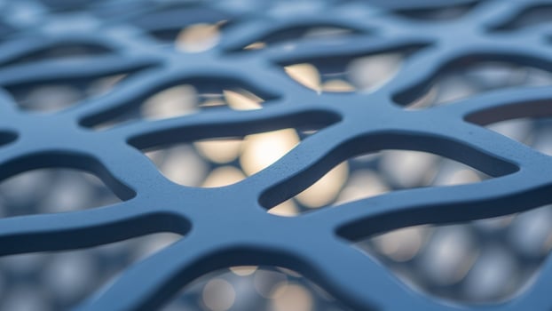 A close up of a metal mesh with holes photo