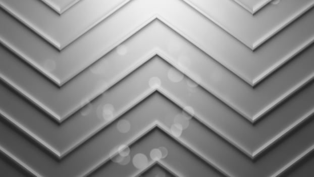 A gray background with a chevron pattern photo