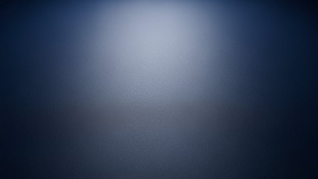 A dark blue background with a spotlight shining on it photo