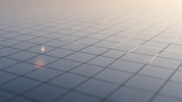 A grid of squares on a table with a light shining on it photo