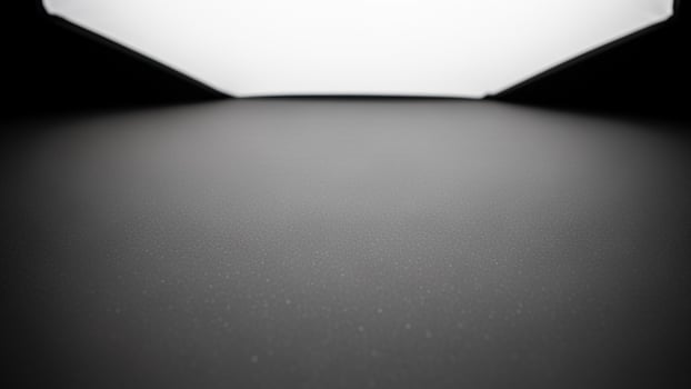 A black and white photo of a light in a dark room