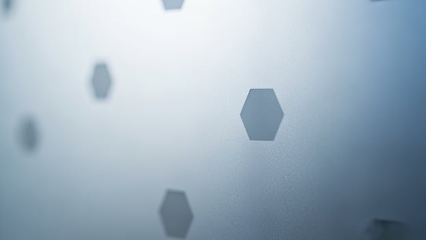 A blue wall with hexagon shapes on it photo
