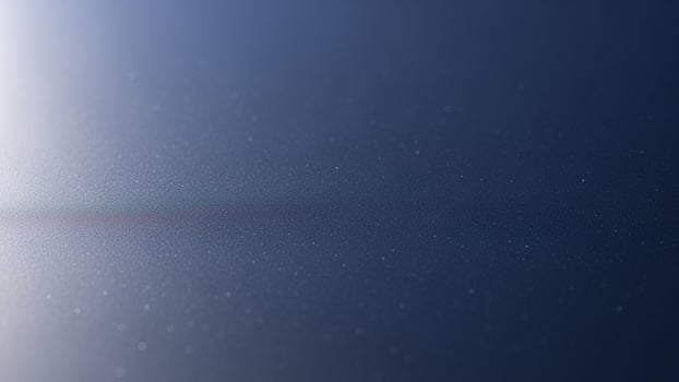 A blue sky with a bright light shining through it photo