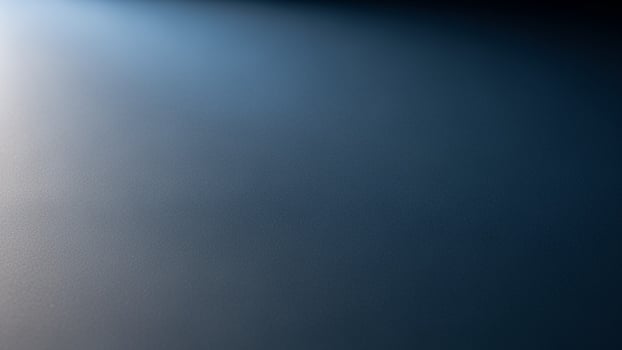 A blue light shines through the dark sky photo