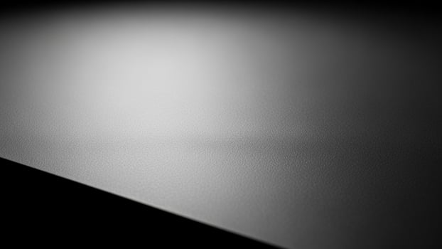 Black and white photo of a table with a light shining on it