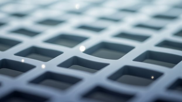 A close up of a metal grate with squares photo
