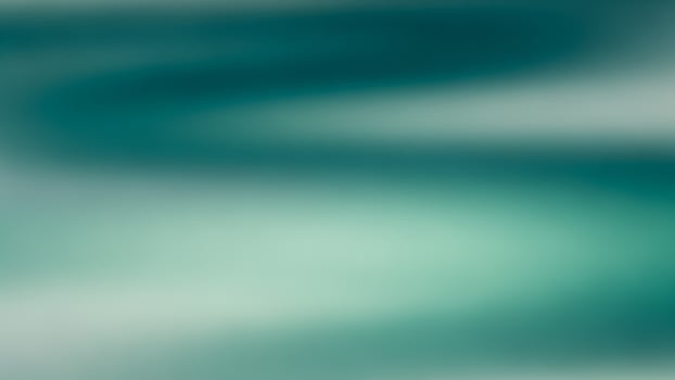 A blurry image of a wave in the ocean photo