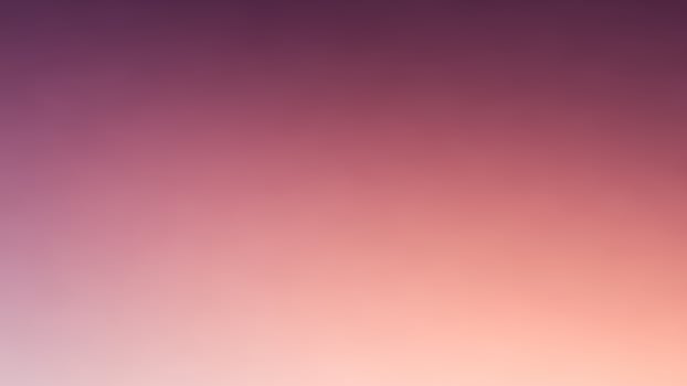 A purple and pink blurred background with a white sky photo